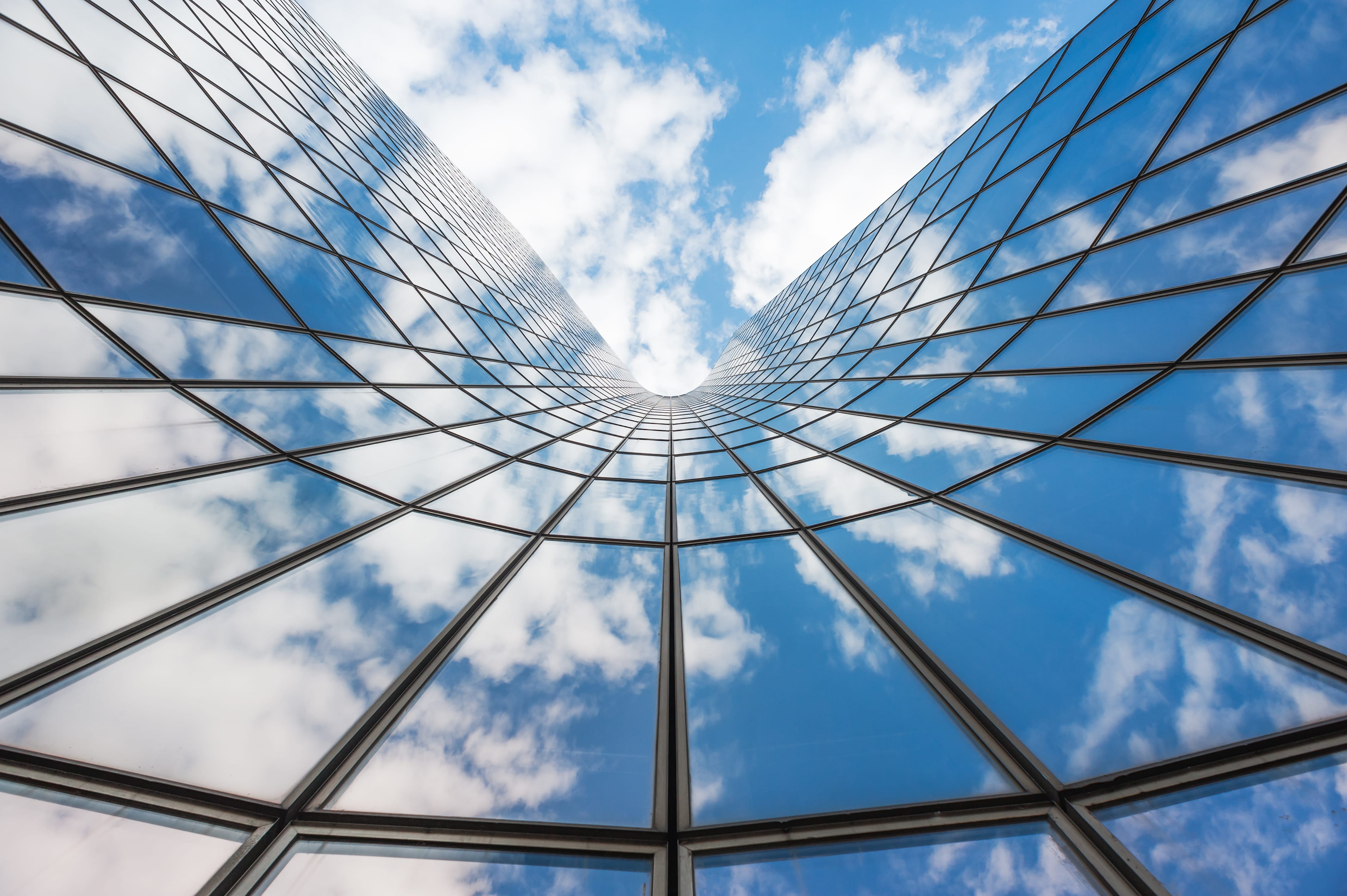 Istock Blue Sky And White Clouds Reflection In Glass Building COMPRESSED